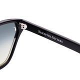 The Samantha Sultana brand name in silver on a jet black high gloss sunglass arm. The hinge is silver.