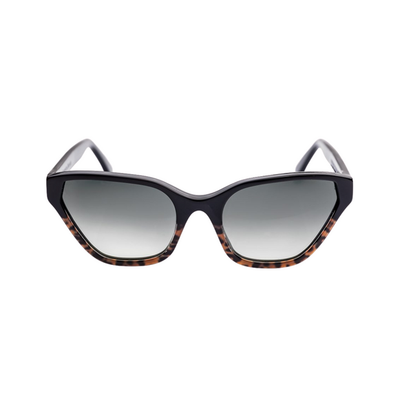 This handmade designer cat eye shaped eyewear is made using premium italian high gloss acetate, with leopard print acetate detail on the lower half of the face frame that rests on the cheek. The lenses have a graduated smokey gray tint.